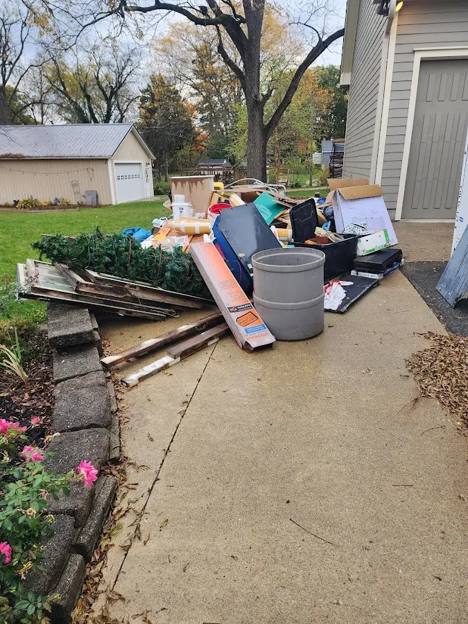 Dumpster being loaded with debris for 10 Yard Dumpster Rental in Wabash